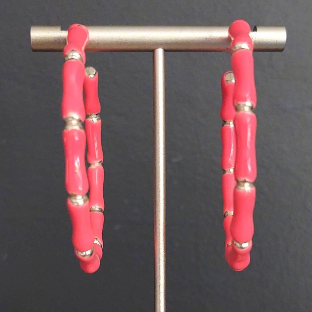 Bright glossy salmon pink enamel and silver tone hoops